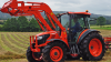 Tractor with slasher pallet forks 4:1 bucket ,hay spike, auger , post hole rammer